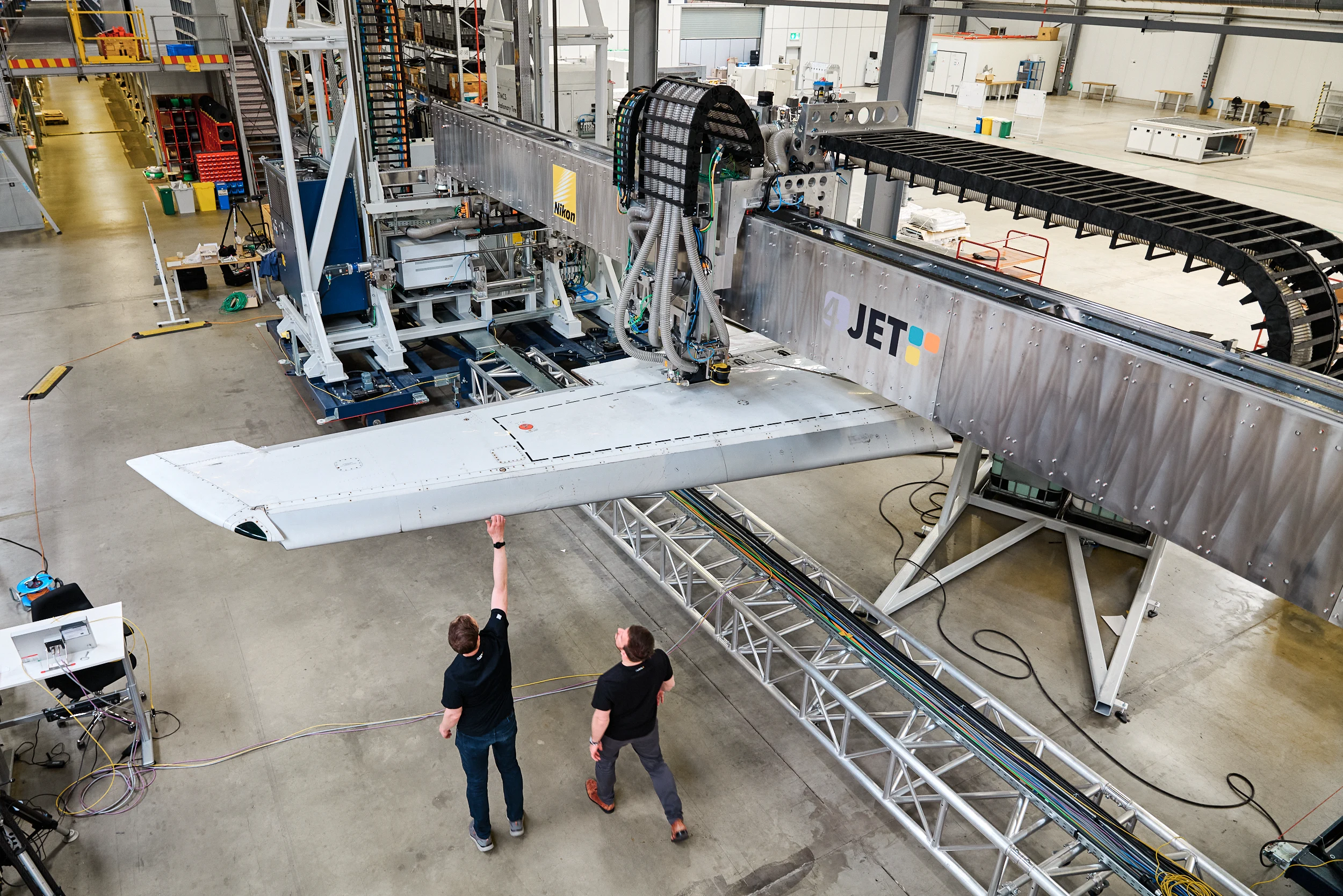 Overview of the 4JET laser system and aircraft wing