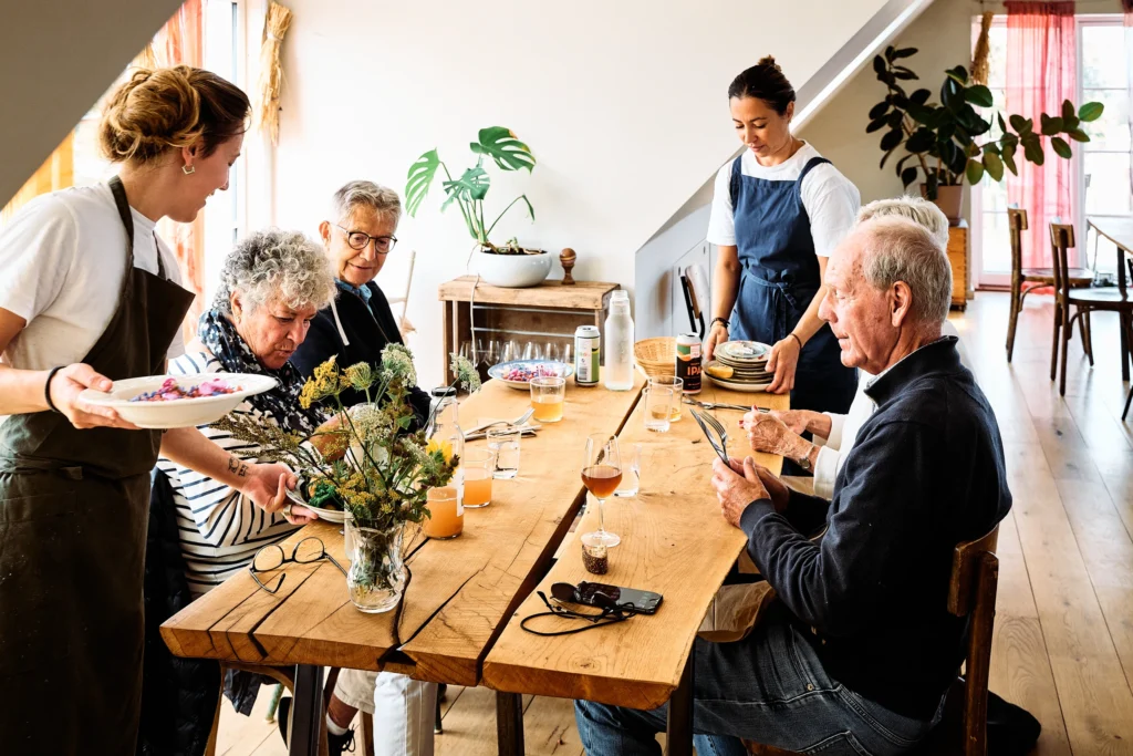 Guests sharing a meal at Birkemosegaard