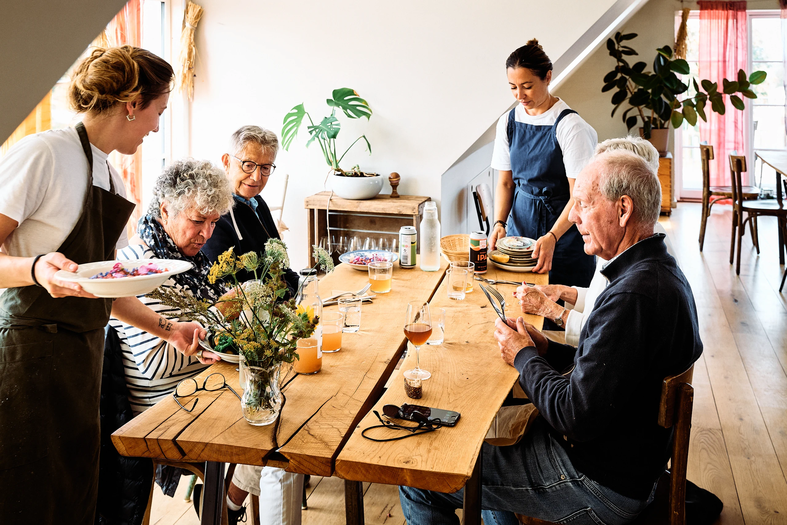 Guests sharing a meal at Birkemosegaard