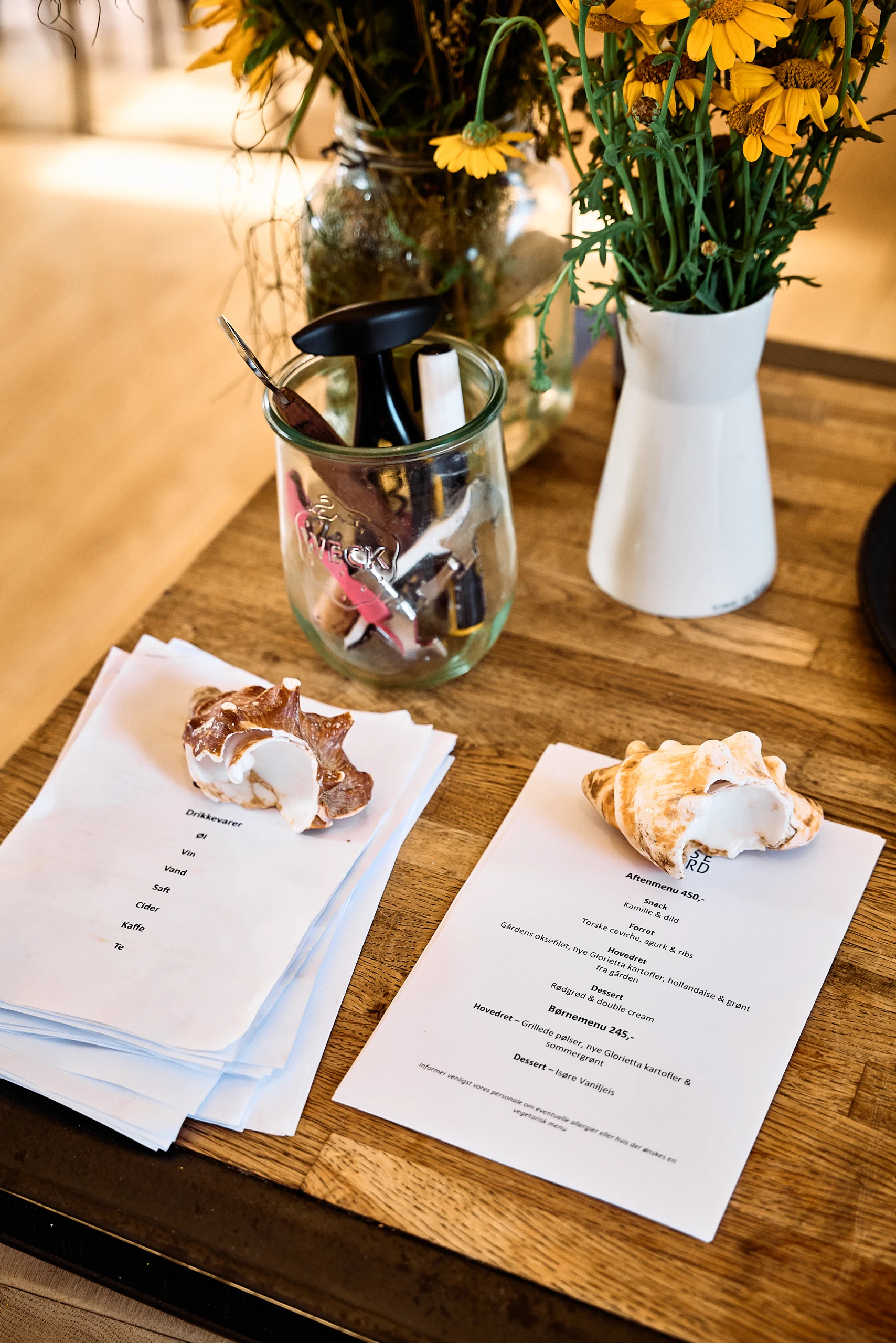 Menu and flowers on a dining table at Birkemosegaard