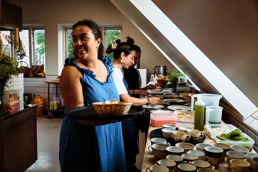 A chef presenting a freshly prepared dish