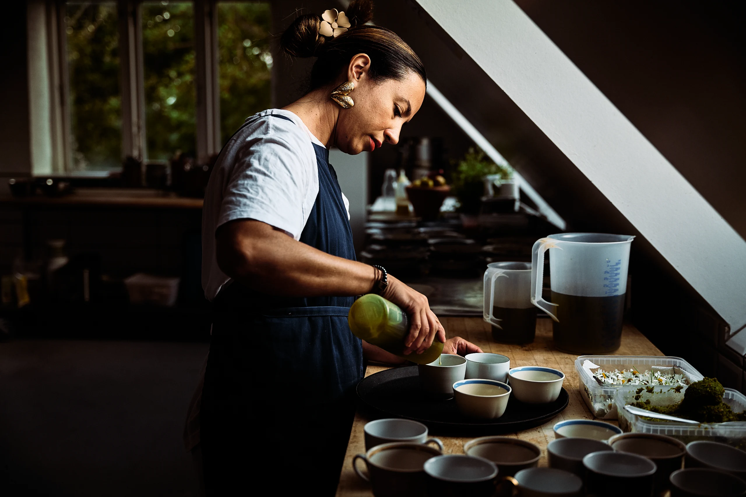 A chef cooking at the stove in the Birkemosegaard kitchen