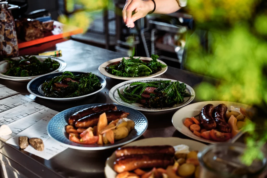 Farm-to-table dishes arranged outdoors at Birkemosegaard