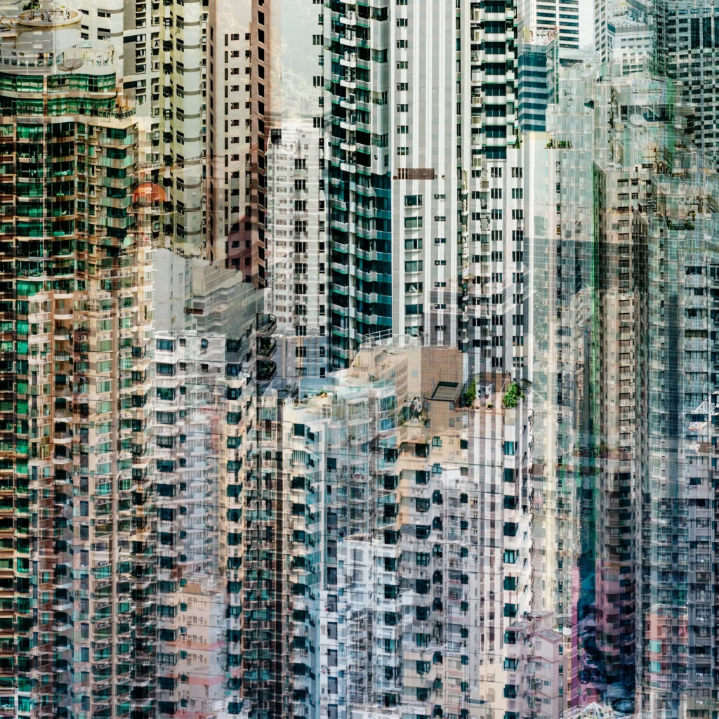 Abstract multilayer photograph of Hong Kong’s dense high-rise architecture, with overlapping façades in teal, white and warm tones and a construction crane among the buildings.