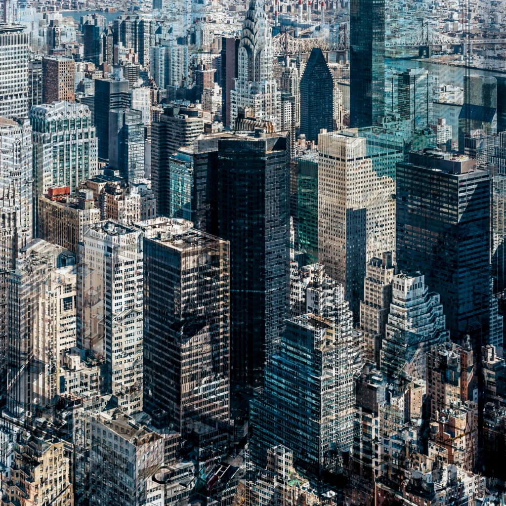 Abstract multilayer photograph of Manhattan architecture, combining overlapping urban structures, movement and light into a dense geometric composition.