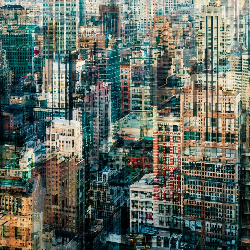 Abstract multilayer photograph of Manhattan architecture, combining overlapping urban structures, movement and light into a dense geometric composition.